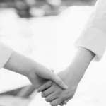 Couple holding hands