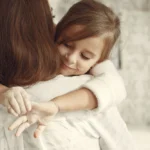 Mother and daughter hugging